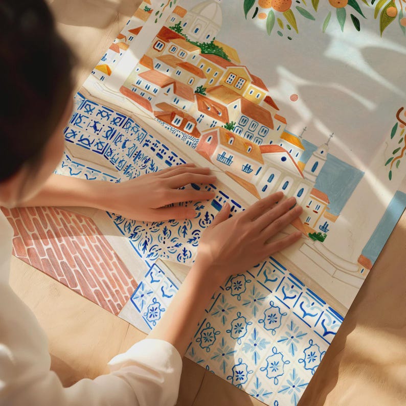 May include: A watercolor illustration of a European town with orange rooftops, white buildings, and blue accents. The artwork features a detailed depiction of architecture and decorative tile patterns. The image is on a white background with a hint of orange tree branches.