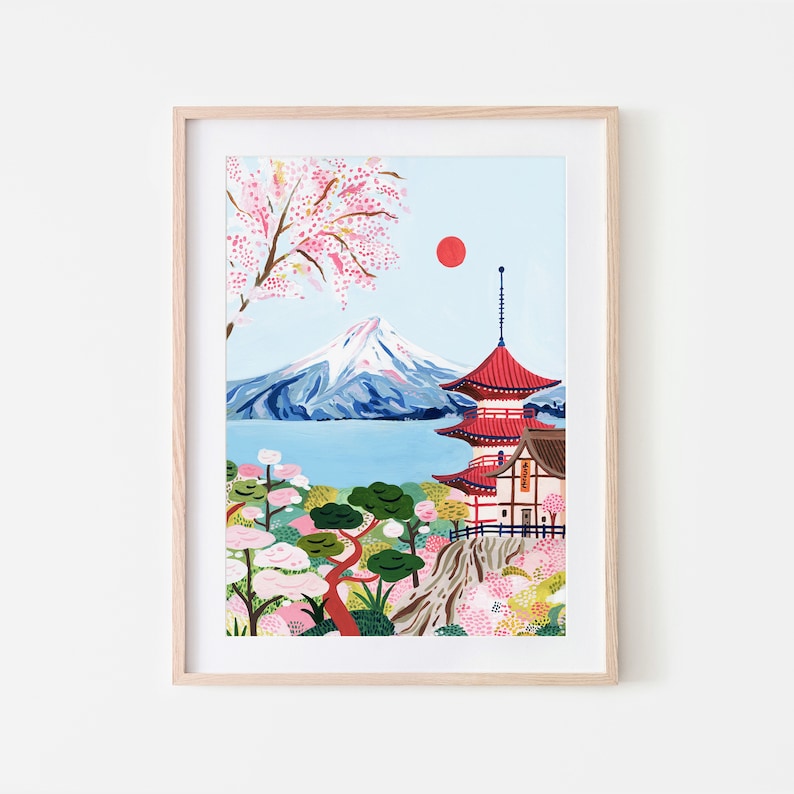 May include: A colorful illustration of Mount Fuji with a red pagoda in the foreground. The mountain is snow-capped and surrounded by a blue lake. Pink cherry blossoms are in bloom in the trees.