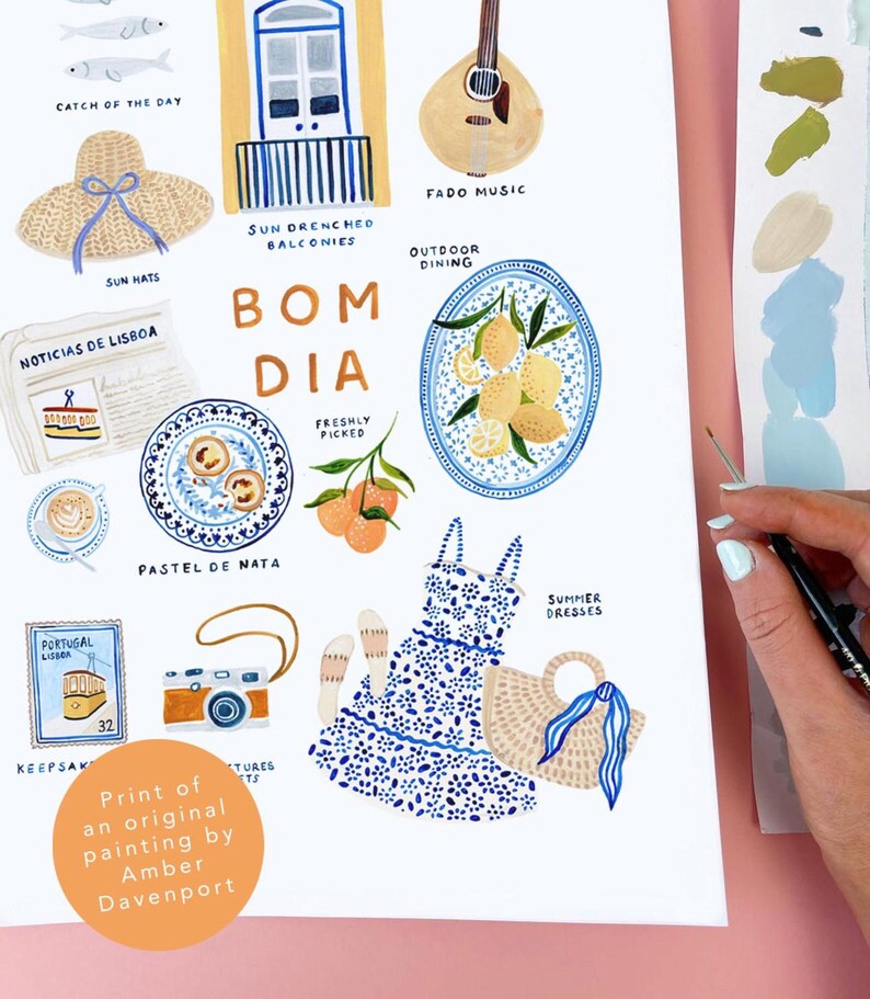 May include: An illustrated print featuring Portuguese themes. Includes images of a guitar, plates of food, a dress, a camera, and the words "BOM DIA". The print is signed by Amber Davenport.