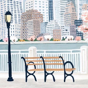May include: A black metal bench with wooden slats sits on a sidewalk in front of a white picket fence. A city skyline with buildings in shades of blue, gray, and brown is visible in the background. The buildings have windows and are decorated with pink flowers.