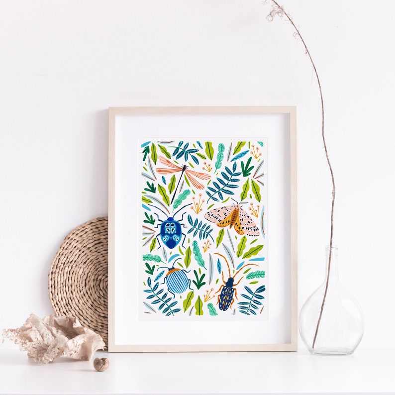 May include: A framed print with a white background and a colorful pattern of insects and leaves. The insects include a dragonfly, a moth, and two beetles. The leaves are green and blue.
