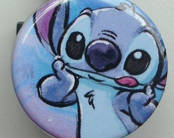 Stitch illustration with tongue sticking out badge reel