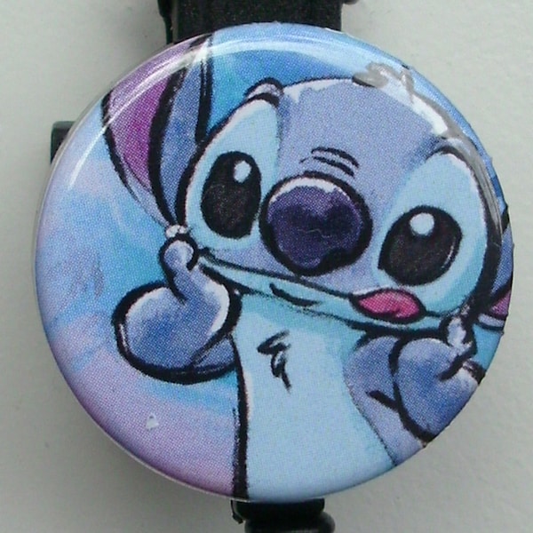 Stitch illustration with tongue sticking out badge reel