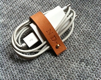 Customized charger cord organizer in leather. Made in France