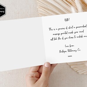 May include: A white card with black text that reads "Hello! This is a preview of what a personalized message printed inside your card will look like if you choose to include one. Love from Boutique Stationery Co. kkkk"