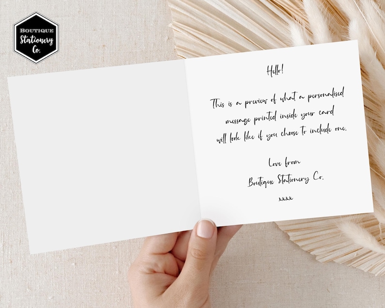 May include: A white card with black text that reads "Hello! This is a preview of what a personalized message printed inside your card will look like if you choose to include one. Love from Boutique Stationery Co. kkkk"