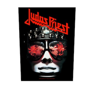 May include: A black and red band patch with the text "Judas Priest" in red letters. A masked face with red-tinted sunglasses is in the center of the patch.