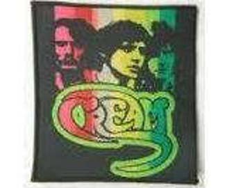 CREAM patch:  band members sew on woven patch .   Eric Clapton,  Ginger Baker, Jack Bruce