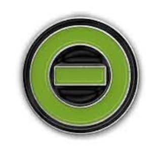 May include: A green and black circle pin with a smaller green rectangle inside. The circle has a black outline.