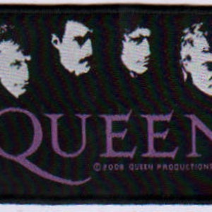 May include: Black and white patch with the band name "QUEEN" in purple lettering. The band members' faces are shown in white on a black background.
