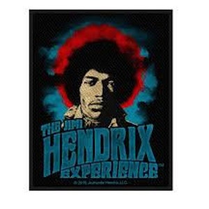 May include: A black and white image of Jimi Hendrix with a red and blue background. The text "The Jimi Hendrix Experience" is printed below the image.