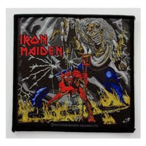 May include: Iron Maiden band patch featuring a black background, a red devil, and a silver Eddie figure with a lightning bolt behind him. The text "Iron Maiden" is in white.