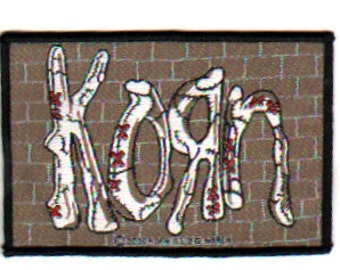 KORN patch:   Brick Wall sew on woven patch.  Officially licensed  Nu metal/ rock band