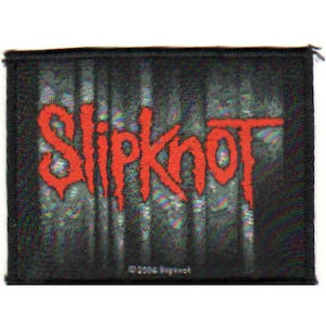 May include: Black and white fabric patch with the word "Slipknot" in red lettering. The patch has a textured background and a copyright symbol with the year 2004 and the word "Slipknot".