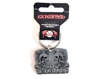 The Exploited metal official keyring, with the 2 punk mohican heads, very collectable from 2009.  Scottish punk rock.