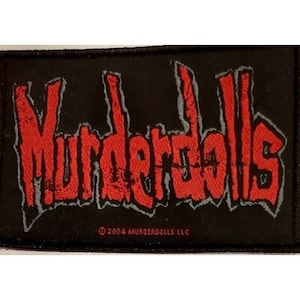 May include: Black fabric patch with the red text "Murderdolls" and the copyright symbol followed by "2004 Murderdolls LLC".