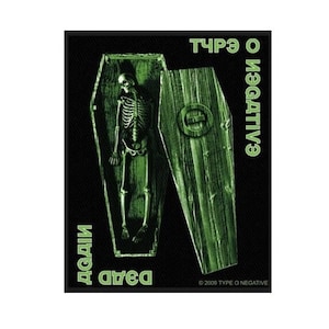May include: Black and green embroidered patch with a skeleton in a coffin. The text "Type O Negative" and "Dead Again" are on the patch.  © 2009 Type O Negative.