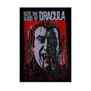 May include: Black and red embroidered patch featuring the text "Taste the Blood of Dracula" and a graphic of a vampire's face with fangs and dripping blood.