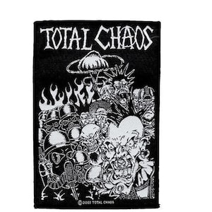 May include: Black and white embroidered patch featuring the text "TOTAL CHAOS" and a graphic of a mushroom cloud and several cartoon figures. The text "© 2003 TOTAL CHAOS" is at the bottom of the patch.