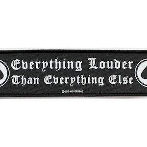 May include: Black and white embroidered patch with a spade symbol and the text "Everything Louder Than Everything Else" with the copyright symbol and "1979 MOTÖRHEAD".