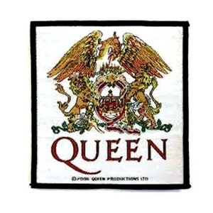 May include: A white square patch with a black border featuring the Queen band logo. The logo is a crest with a phoenix, two lions, and a crown. The word "QUEEN" is written in red below the crest. The text "© 1981 QUEEN PRODUCTIONS LTD" is written in black below the word "QUEEN".
