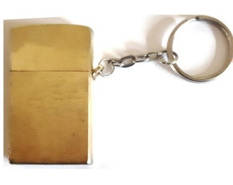 Lighter keychain- Gold coloured lighter that is also on a keychain. New