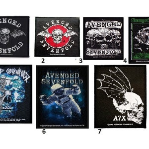May include: Seven iron-on patches featuring the band Avenged Sevenfold. The patches feature various designs including a skull with wings, an astronaut, and a skull with a bat.