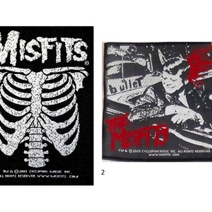 May include: Two black and white embroidered patches featuring the band name "Misfits" in white lettering. The first patch shows a white skeleton ribcage. The second patch features a black and white image of a person in a leather jacket with the band name "Misfits" in red lettering.