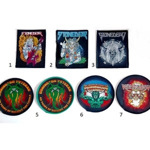 May include: Seven embroidered patches, including three black patches with the word "STONEDEAR" and a skull design, and four round patches with various designs, including a green monster, a green monster with flames, a green monster with a red, white, and blue background, and a skull with flames.