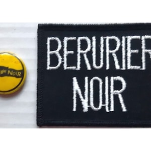 May include: A black patch with white embroidery that reads "BERURIER NOIR". A yellow button with black text that reads "BERURIER NOIR" is also included.