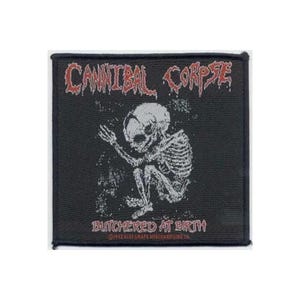 May include: Black square patch featuring the band name "Cannibal Corpse" in red, stylized text. Below, a white illustration of a skeleton in a fetal position. The text "Butchered at Birth" is below the skeleton.