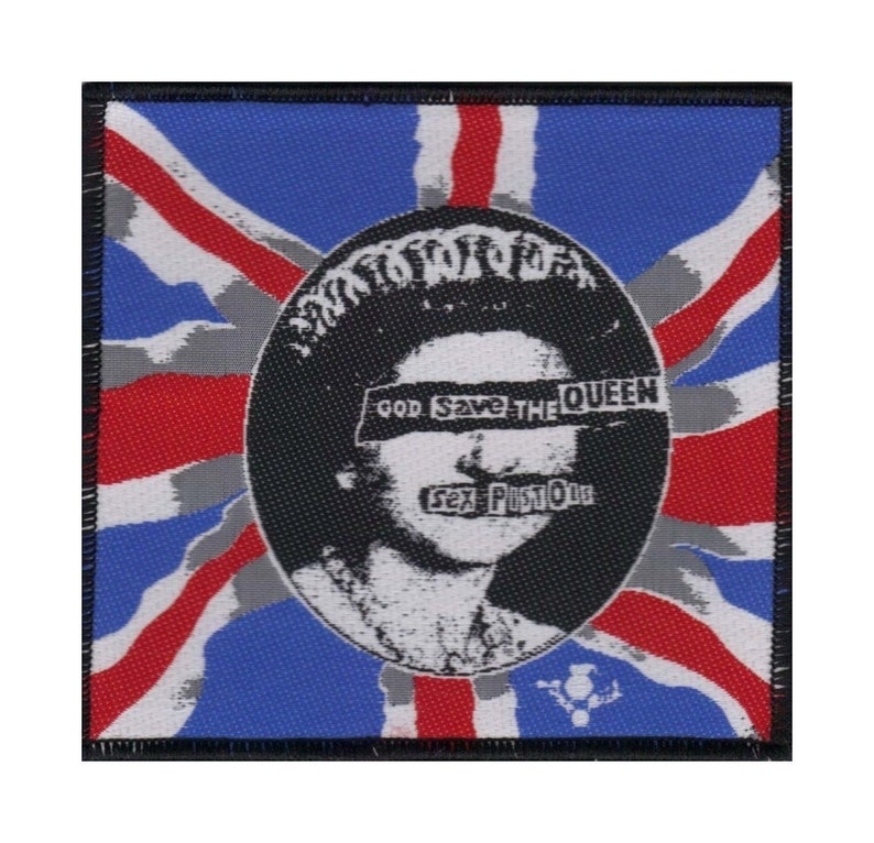 May include: A black and white image of Queen Elizabeth II with the words "God Save The Queen" and "Sex Pistols" superimposed over her face. The image is set against a red, white, and blue Union Jack flag.