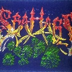 May include: A blue embroidered patch with the word "SLAUGHTER" in a stylized font with red, yellow, and green accents.