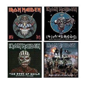 May include: Four Iron Maiden album covers featuring different band artwork. The top left album cover features a samurai warrior with the text "戦" and "術". The top right album cover features a skull with the text "Can I Play With Madness". The bottom left album cover features a skull with the text "The Book Of Souls". The bottom right album cover features a tank with soldiers and the text "A Matter Of Life And Death".