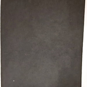 May include: A dark grey, textured, rectangular piece of fabric.