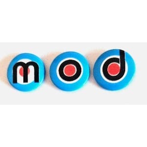 May include: Three round, blue buttons with the word "MOD" spelled out. Each button has a white border, a black ring, and a red center. The letter "m" is in black, and the letter "d" is in black with a white outline.