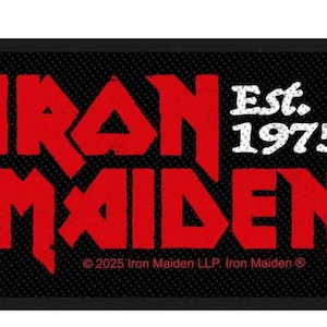 May include: Black rectangular patch featuring the band name "IRON MAIDEN" in red, distressed lettering. The text "Est. 1975" is in white. The patch has a textured background and the copyright information.
