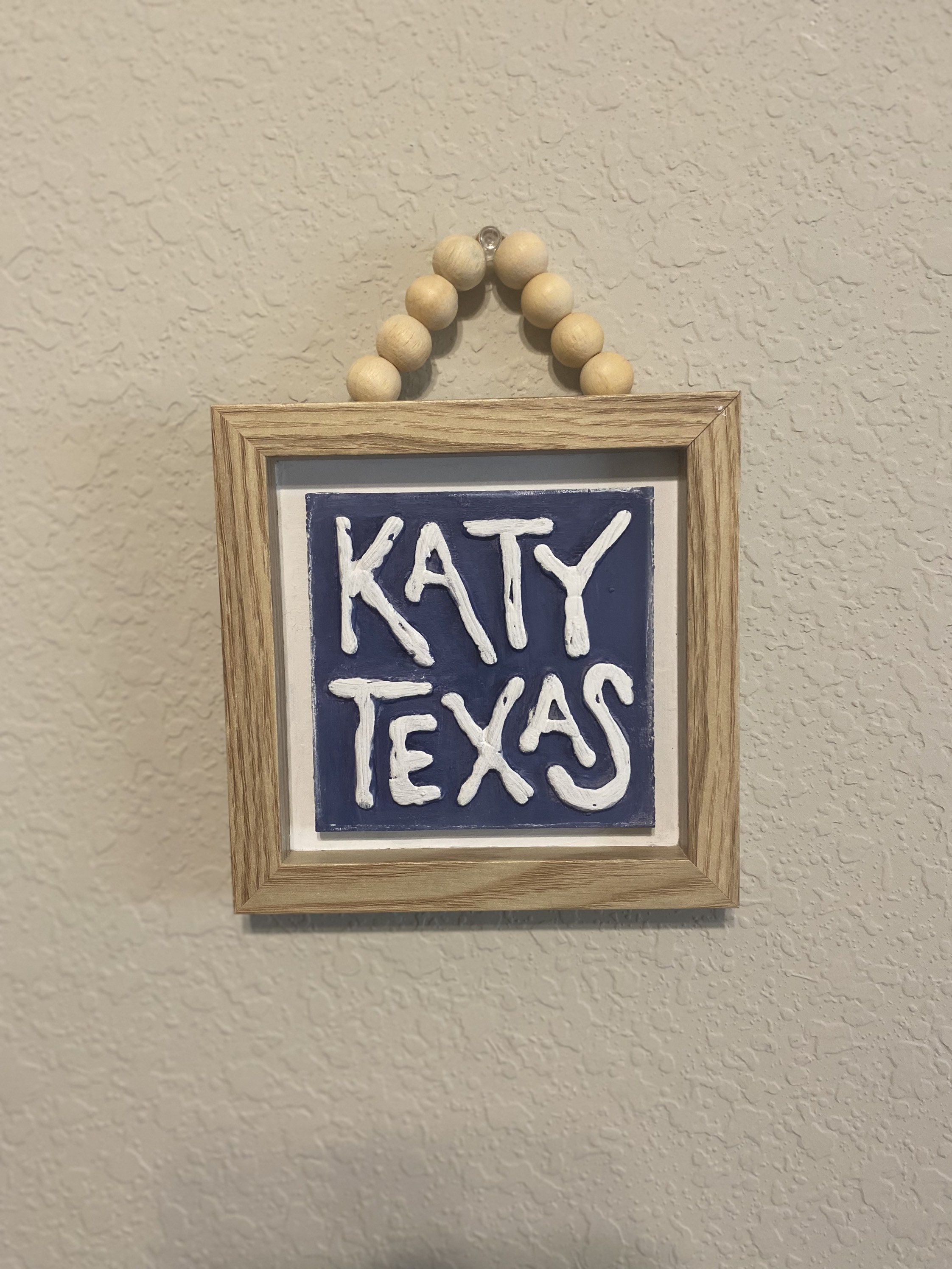 Natural frame features the town of Katy, Tx. Perfect for home decor or could be used as large ornaments