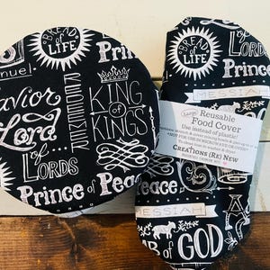 Reusable bowl covers in "Names of Jesus" print.  Black background fabric with white lettering and designs, proclaiming Jesus's names including: Savior, Lord, Bread of Life, Prince of Peace, Lamb of God, King of Kings.