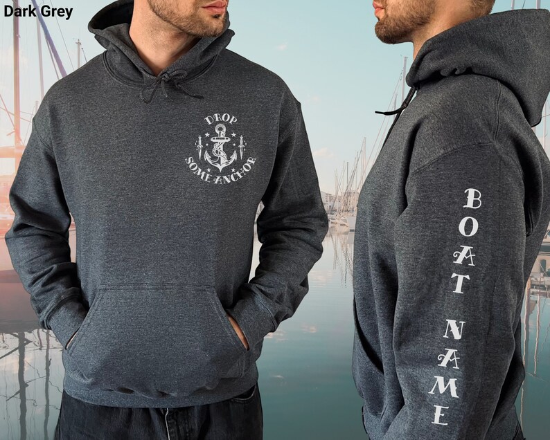 May include: Dark grey hooded sweatshirt with a white anchor graphic and the text "Drop Some Anchor" on the front. The left sleeve has the text "Boat Name" vertically down the sleeve.