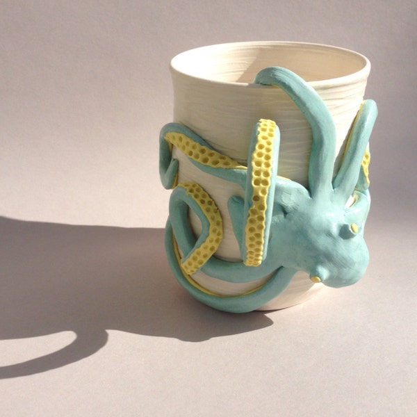 Ceramic porcelain clay mug with turquoise and yellow octopus