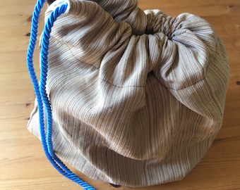 Lined shoe bag with blue cord drawstring