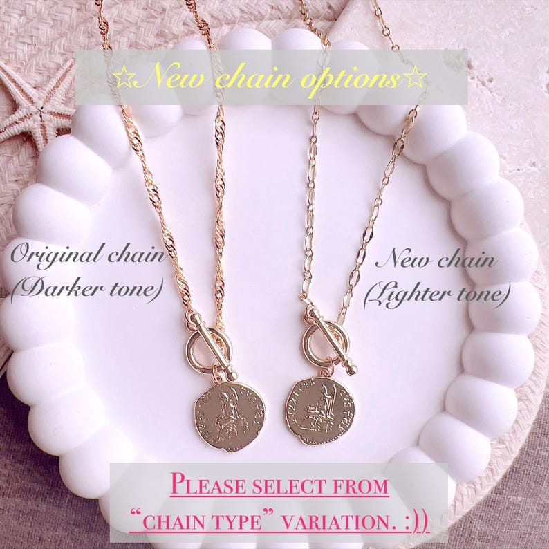 May include: Two gold-toned necklaces with toggle clasps and circular coin pendants. The left necklace features a twisted chain, labeled as Original chain (Darker tone). The right necklace has a flat link chain, labeled as New chain (Lighter tone). Text reads: New chain options, PLEASE SELECT FROM CHAIN TYPE VARIATION. :))