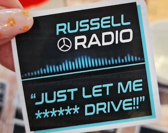 May include: A square sticker with the text "RUSSELL RADIO" in white and teal. Below the text is a graphic of sound waves and the phrase "JUST LET ME ***** DRIVE!!!" in teal. The sticker is held by a hand.