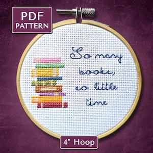 May include: Cross-stitch embroidery in a wooden hoop with the text "So many books, so little time." A stack of colorful books is stitched on the left. The hoop is 4 inches in diameter. The words "PDF Pattern" are in the upper left.