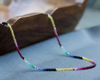 14k gold multi gemstone necklace, ruby, emerald, yellow and blue sapphire and gold bead long necklace, multi-strand layer bracelet.
