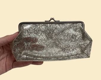 70s clear makeup bag with silver pattern, abstract 1970s travel cosmetics pouch with metal kiss lock and frame