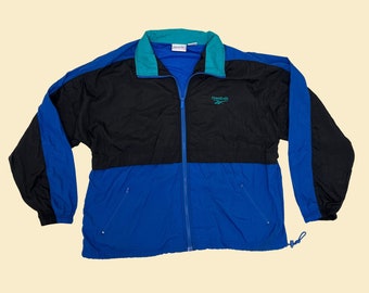 Vintage XL Reebok windbreaker jacket, 1990s color block patterned windbreaker with retractable hood, blue black and teal tracksuit top