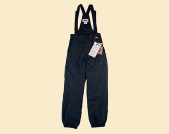 90s Obermeyer women's ski pants, size 6, new old stock, vintage 1990s solid black nylon snow pants with shoulder straps