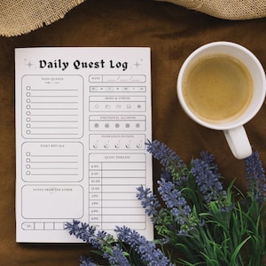 May include: A white printable daily quest log with sections for main quests, daily rituals, notes from the ether, and a quest timeline. The log is decorated with stars, moons, and other magical symbols.